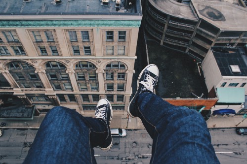 Hanging on the edge of a building